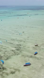 Vertical Video Kitesurfing Near the Shore of Zanzibar Tanzania