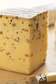 Piece of Belgian cheese with mustard seed and Fenugreek close up - PhotoDune Item for Sale