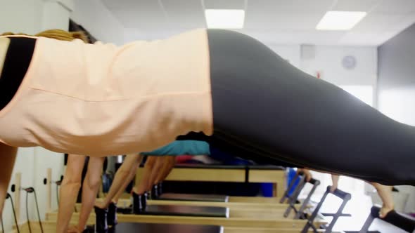 Beautiful women exercising in fitness studio