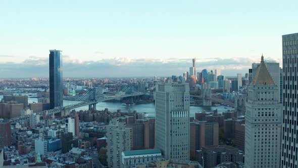 Aerial Footage of Large City and Long Cablestayed Bridges Across River