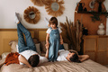 A young married couple with their cute daughter. The family spends time at home - PhotoDune Item for Sale