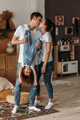 Portrait of a happy young family. Happy family mother, father, little daughter - PhotoDune Item for Sale