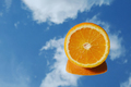 Orange citrus fruit tropical orange on blue sky and clouds background. - PhotoDune Item for Sale