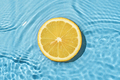 Circle texture fruit summer lemon in bright pool with wave movement fresh water. - PhotoDune Item for Sale