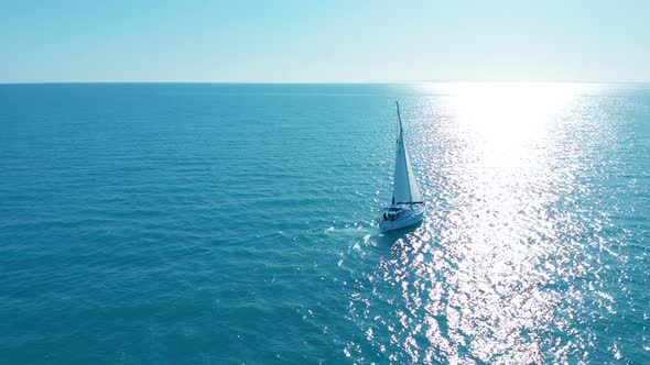 Aerial View. Yacht Sailing on Opened Sea. Sailing Boat. Yacht From Above. Yachting at Windy Day.