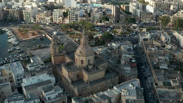 Majestic Beautiful Brown Catholic Church in Msida Town, Malta From Aerial Drone Perspective