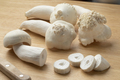 Fresh deformed shimeji mushrooms and slices on a cutting board - PhotoDune Item for Sale