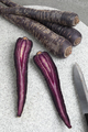Purple carrot and slices on a cutting board - PhotoDune Item for Sale
