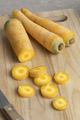 Yellow carrots and slices on a cutting board - PhotoDune Item for Sale