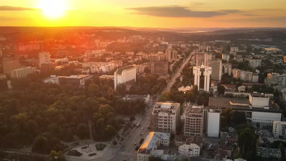 Aerial drone view of Chisinau downtown at sunset. Panorama view of multiple buildings, Parliament, P