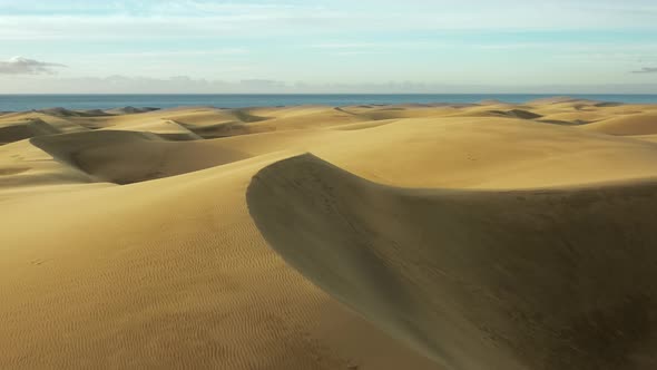 Dunes of Golden Sand in the Hot Arid Desert