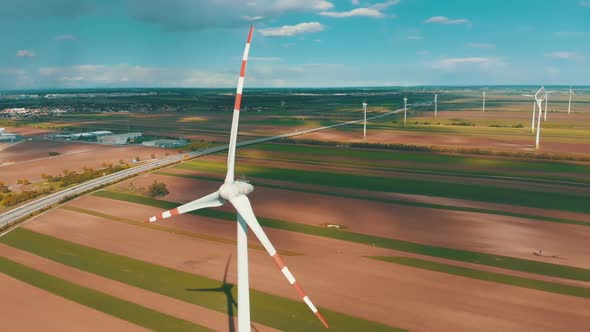 Aerial View of Wind Turbines Farm and Agricultural Fields. Austria