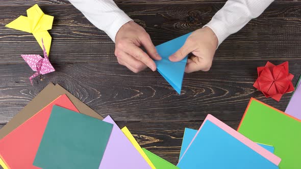 Hands Folding Paper Crane, Fast Motion.