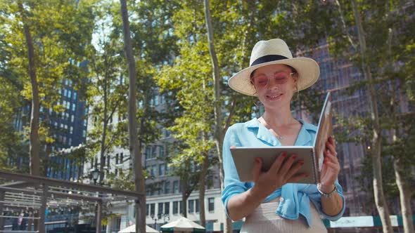 Attractive woman with a book in New York City