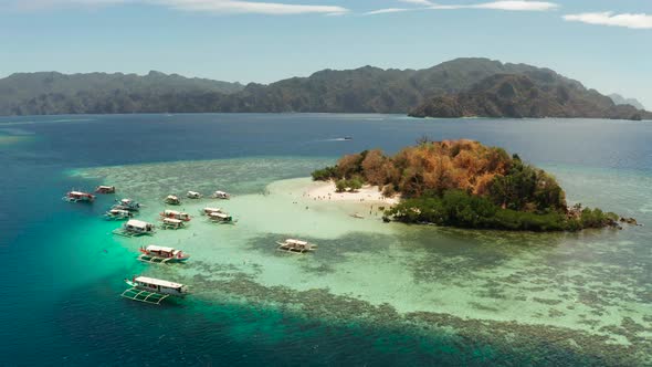 Small Tropical Island with White Sandy Beach, Top View