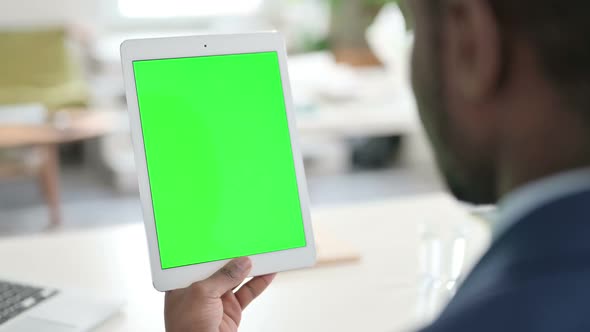 Businessman Using Tablet with Green Chroma Key Screen