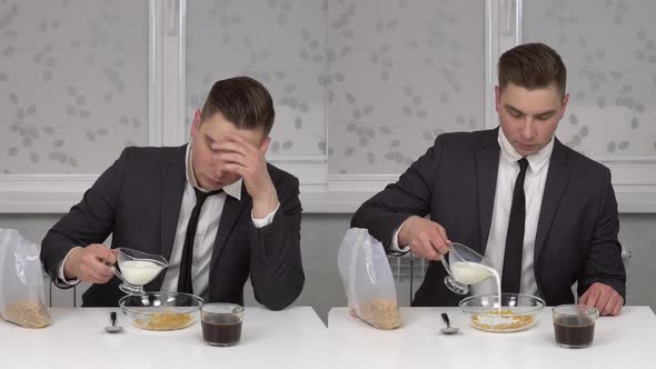 A Young Man in a Suit Eats Cereal and Drinks Coffee Sleepy and Cheerful