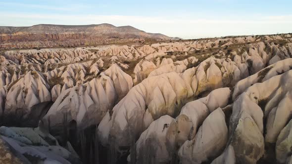 Cappadocia Aerial Drone or Balloon View to Red and Rose Valley Rock Formation Ancient Cave Churches