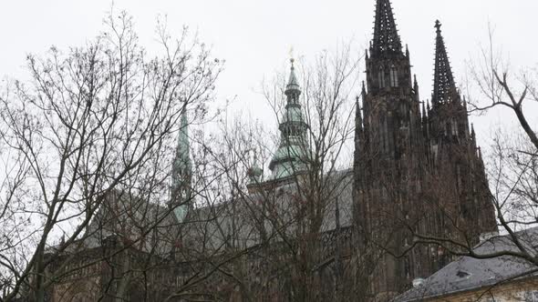 Bell towers of   Gothic style church in Prague Czechia Czech Republic slow tilt 4K 2160p 30fps Ultra