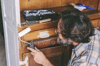e. Concept of sustainability lifestyle and recycled circular market items. Happy male people in diy hobby leisure activity at home