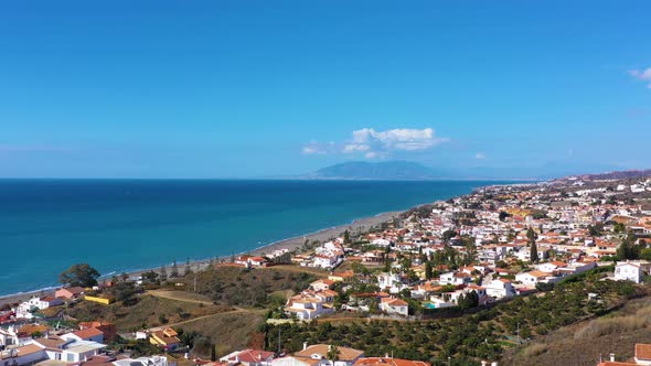 Fly over the village in the region of Malaga Andalusia Benajarafe Spain.