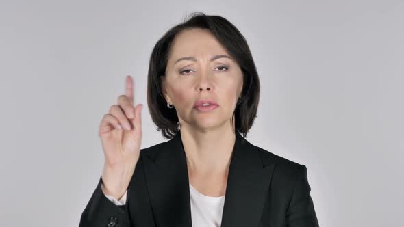 Portrait of Businesswoman Waving Finger to Refuse