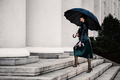 Young woman under an umbrella walking the stair - PhotoDune Item for Sale