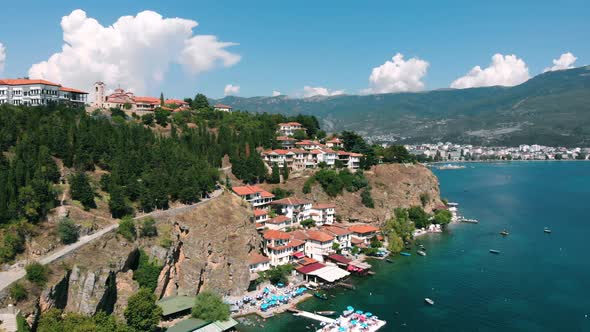 Aerial shot of Macedonia coast. Clif and Ohrid City (Kaneo), beautiful water around Ohrid Lake in So