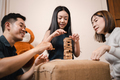 Asian mother, father, pretty daughter playing wooden block tower together in playtime in living room - PhotoDune Item for Sale