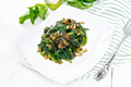 Spinach fried with onions in plate on white board - PhotoDune Item for Sale