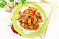 Stir-fry of chicken with peppers in plate on board top - PhotoDune Item for Sale