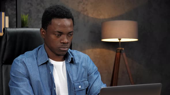 Close Up African American Businessman Works for Laptop Turns to Camera and Smile