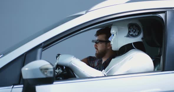 Engineer Testing Car Driving Robot