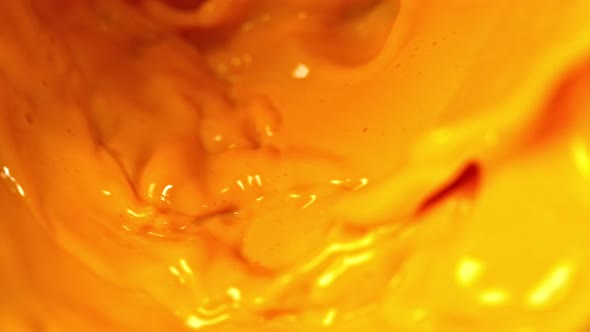 Super Slow Motion Shot of Orange Juice at 1000 Fps.