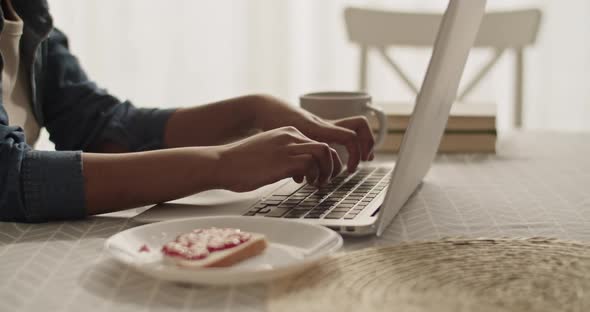 Black Woman Using Laptop for Studies