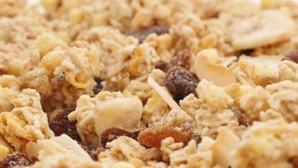 Dried raisins and other fruits in muesli crunch mix food background 4K 3840X2160 UltraHD tilting foo