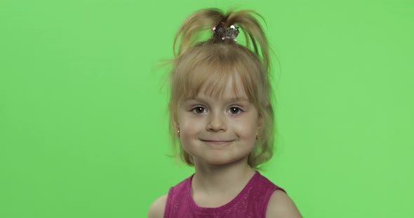 Child Portrait in Purple Dress. Happy Four Years Old Girl Laughing. Chroma Key