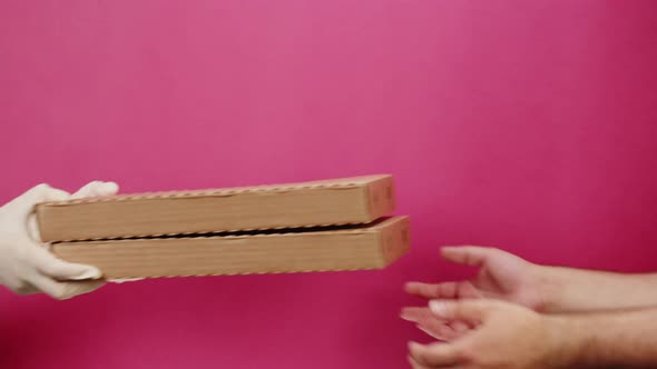 Square Cardboard Boxes on Pink Background