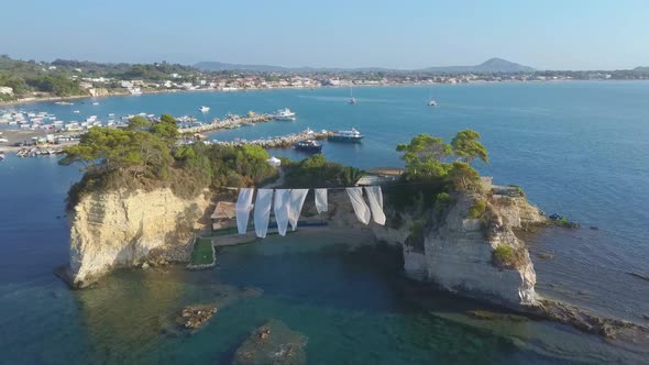 Aerial drone footage of a Beach Club on Cameo Island in Zakynthos, Greece. Zakynthos, or Zante.