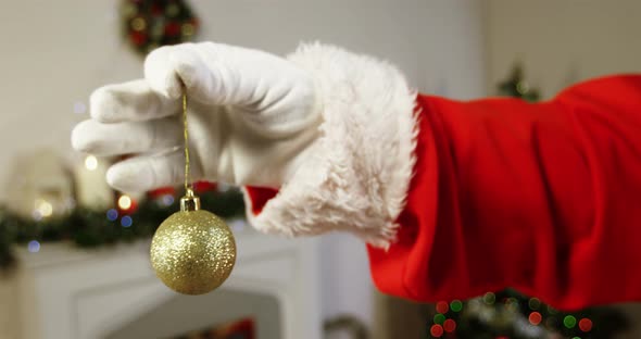 Santa claus holding christmas bauble ball 4k