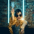 Young happy woman celebrating new year eve drinking champagne with fireworks. - PhotoDune Item for Sale