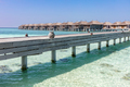 Resort in Maldives. Water villas along wooden jetty - PhotoDune Item for Sale