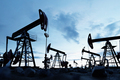 Oil pump jack work on oilfield petroleum extraction - PhotoDune Item for Sale
