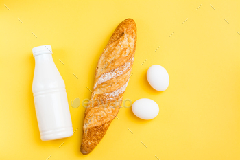 eggs and milk on a yellow background