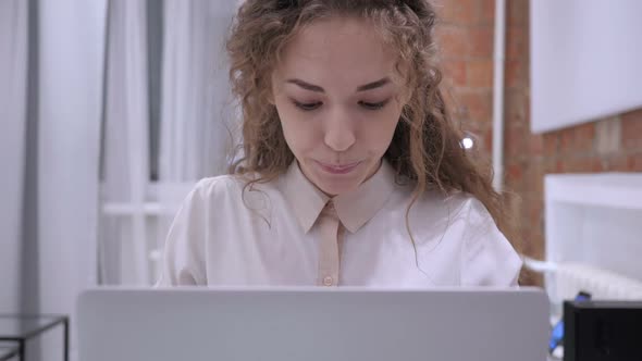 Happy Female Celebrating Success As Working on Laptop