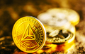 Closeup of golden tron coin TRX cryptocurrency over black and gold background. - PhotoDune Item for Sale