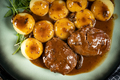 Traditional German braised pork cheeks in brown sauce. - PhotoDune Item for Sale