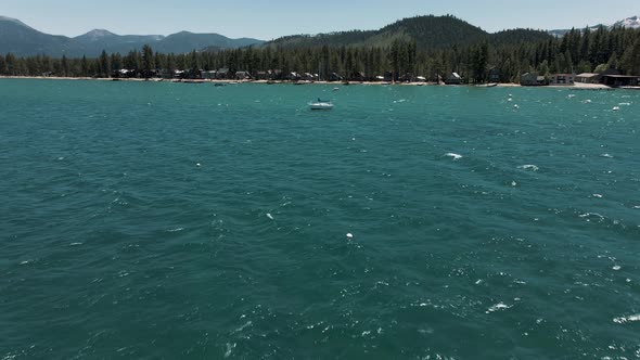 4K Tahoe Lake flight above clear water 