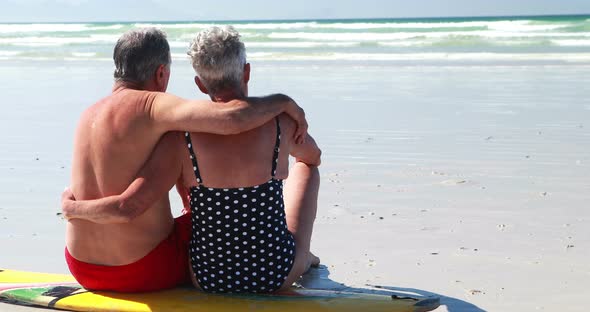 Senior couple sitting on the beach