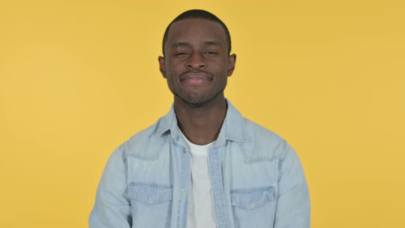 Young African Man Yes By Head Shake, Yellow Background 